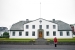 Strange girl in red at the Government House, Reykjavík Iceland
