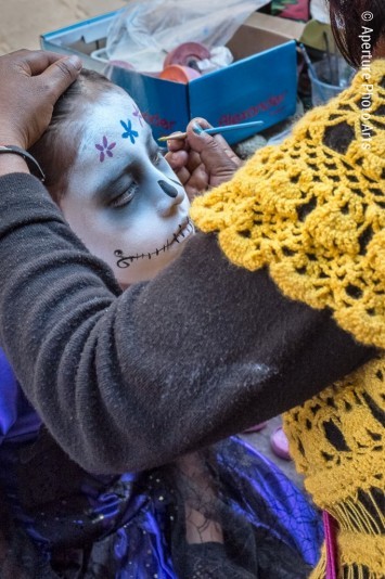 Girl getting face paint. Dia de los Muertos. San Miguel de los Muertos