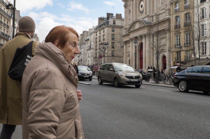 Old lady crossing. Paris France