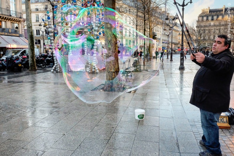 Making giant bubbles. Street of Paris, France