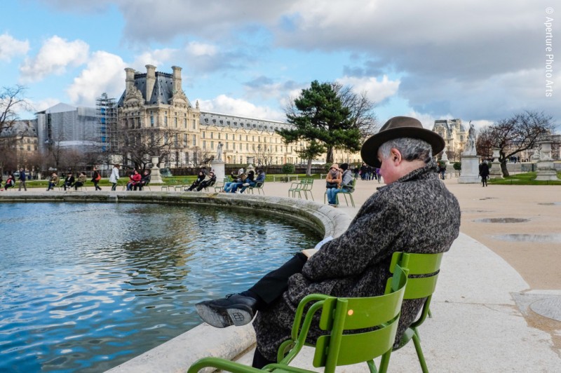 Man reading,  Tuileries Palace, Paris France, fountain, man in hat