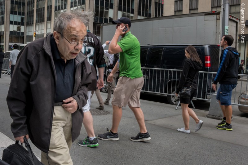 Old man walking in New York City