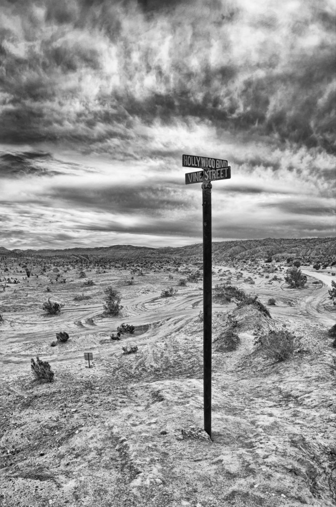 Anza Borrego desert,   street sign with sand and desolation