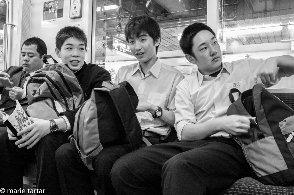 Japanese schoolboys en route to school on the subway in Tokyo