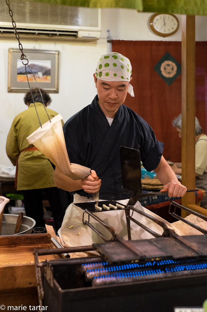 Sembei maker at work in Nishiki Market in Kyoto