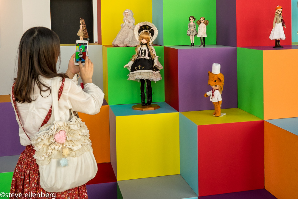 Viewer at doll show at Mori Art Museum in Tokyo