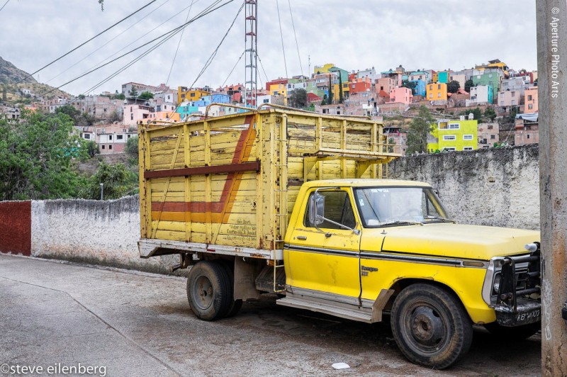 Guanajuato Mexico, yellow truck, hillside town, colorful,