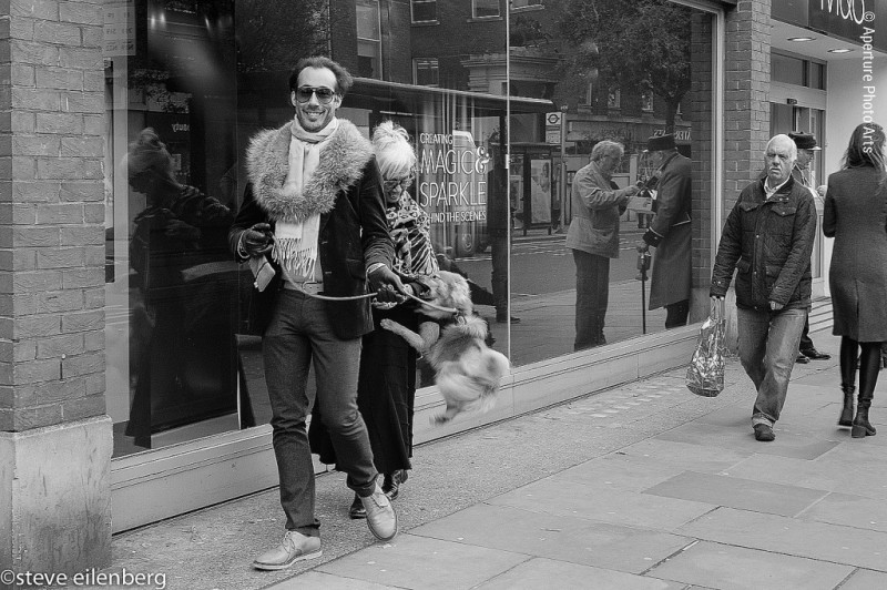 London, street photography, dandy, dandy with dog, little dog, woman being bit by dog,