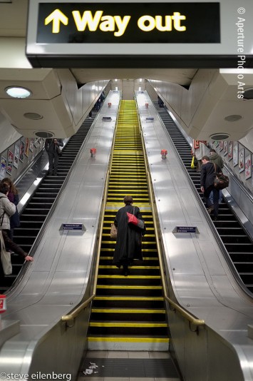 Long staircase, tube, underground, london, woman walking