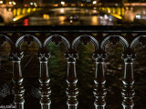 Paris bridge railing at night