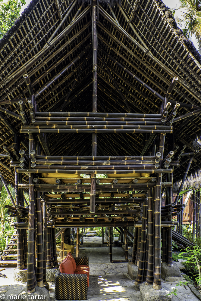 Minang House at Bambu Indah, Ubud, Bali, a replica in black bamboo of the last Sumatran Minangkabau rumah gadang (large clan house). During our stay, construction on another building resulted in it being the dining hall, although it is usually employed for yoga and specials dinners.