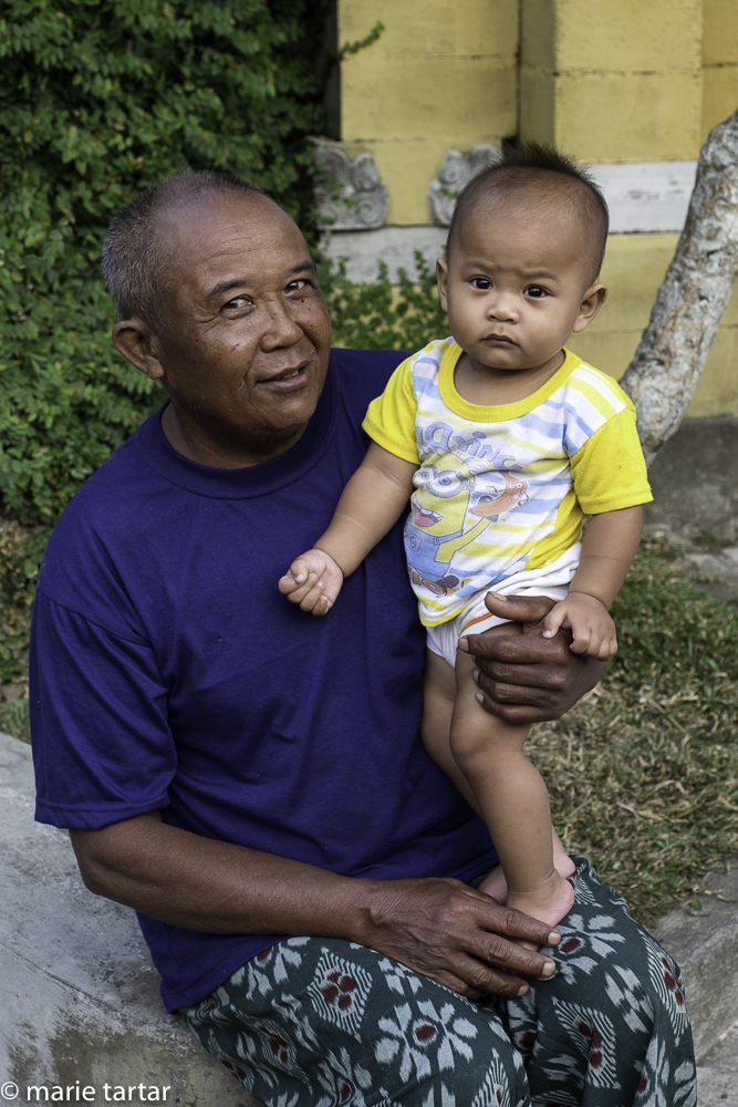 Proud Balinese grandfather with his grandson, near Ubud, Bali
