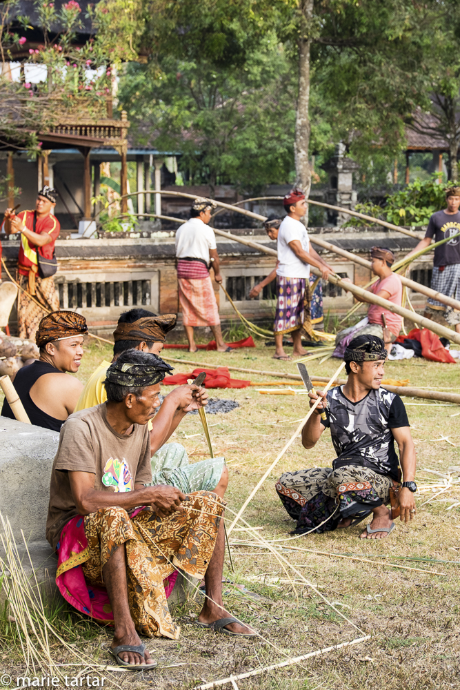 Balinese men prepare for an upcoming festival