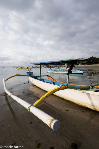 Colorful outrigger boats in Bali, beach at Nusa Penida