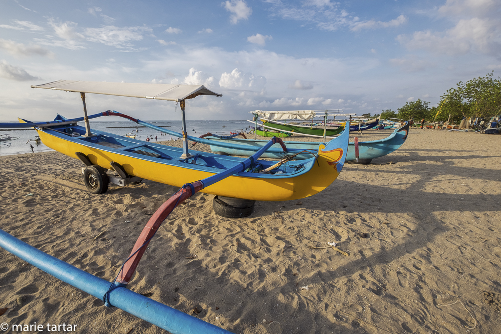 There was time for a late afternoon beach stroll, with colorful outriggers lining the beach at Nusa Penida, Bali
