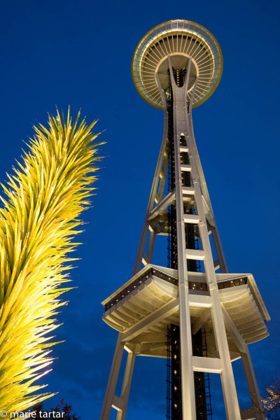 The symbol of Seattle, the Space Needle, set off by a spiky Chihuly installation evoking a succulent