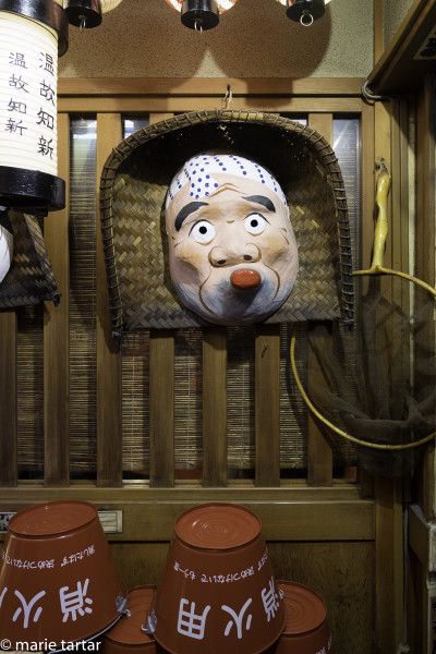 The decor is amsuing and colorful at Gion's okinomiyaki institution, Issen Yoshoku