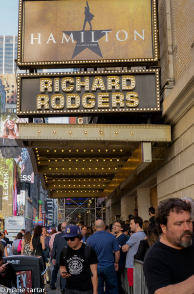 "I've got to be in the (line,theater? No, room) where it happens; Outside the Richard Rogers Theater, where Hamilton hopefuls converge each day