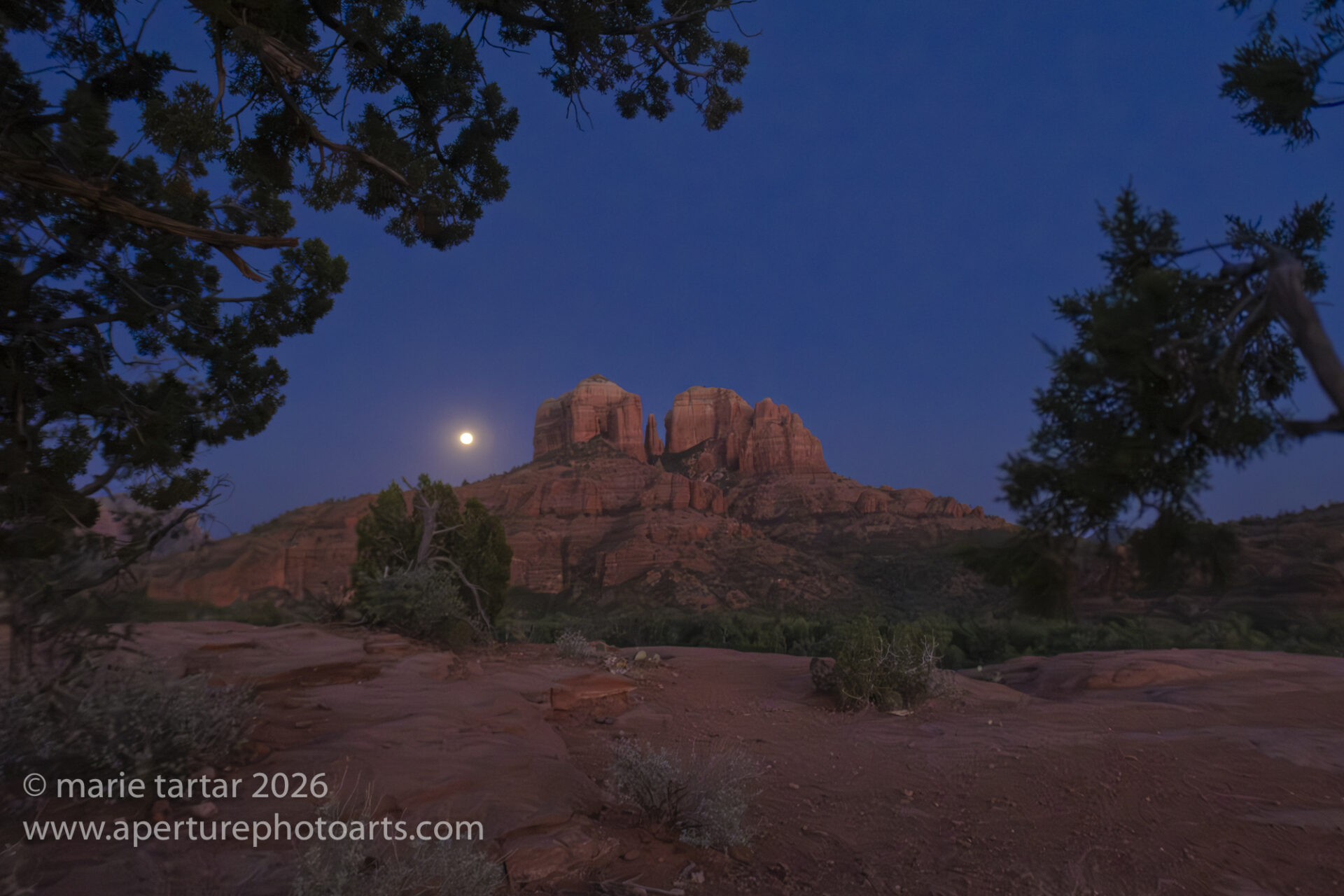 Cathedral Rock in Sedona at night with rising moon